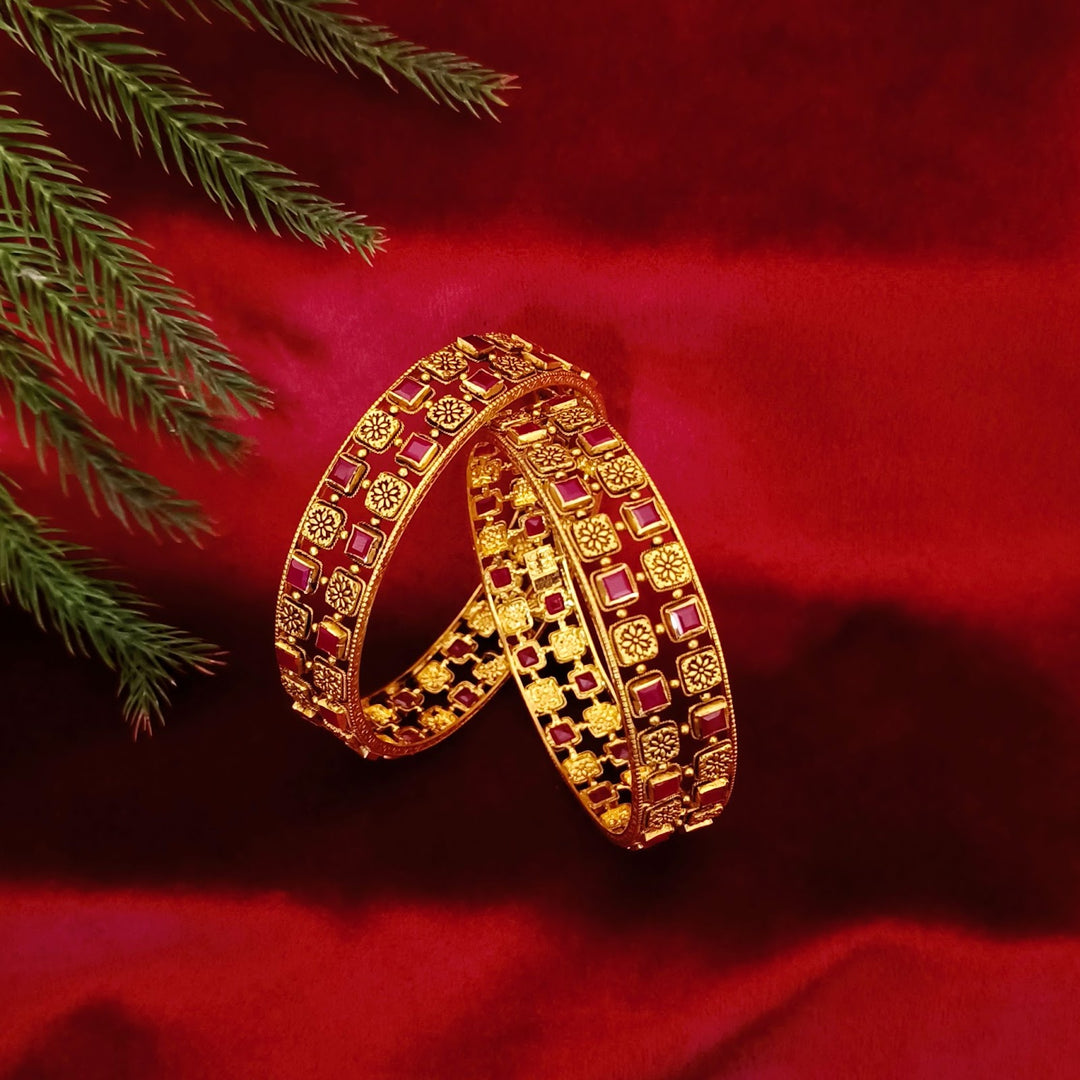 Classic Gold Bangles with Ruby-Colored Stone and Floral Design